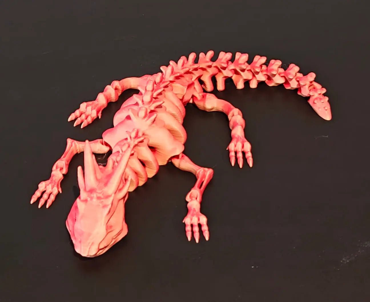 DRAGONIX - "Pete" väriä vaihtava Fidget lohikäärmeen luuranko (S 16cm), (M 24cm), (L 36cm) - PRINT NORDICA